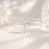 Infinite Loop Moissanite Cross Eternal in sterling silver